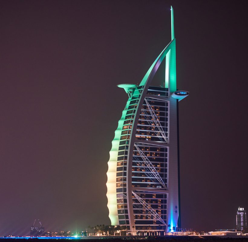 DUBAI, UNITED ARAB EMIRATES - FEBRUARY 23, 2019: Burj Al Arab with colorful lights at night
