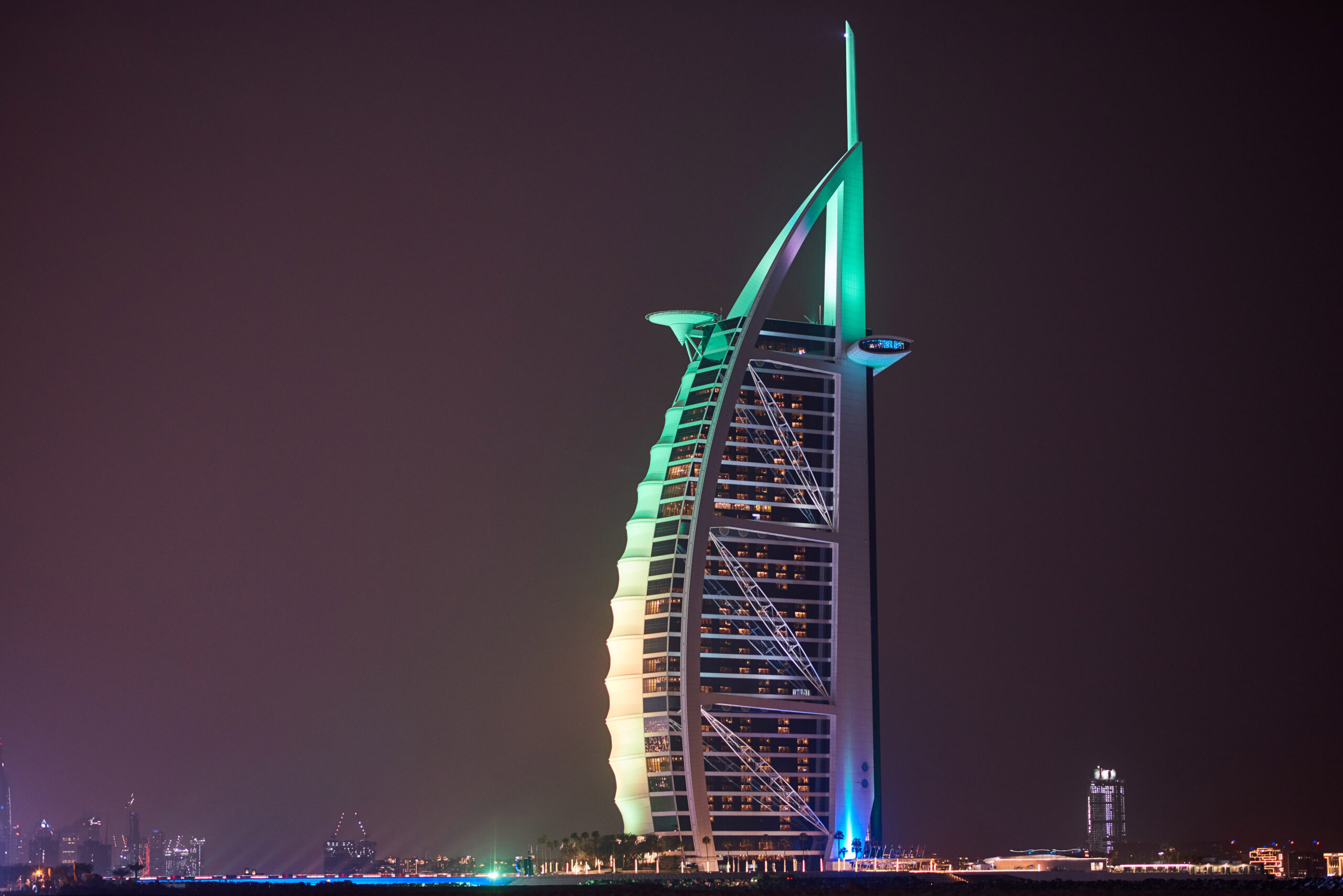 DUBAI, UNITED ARAB EMIRATES - FEBRUARY 23, 2019: Burj Al Arab with colorful lights at night